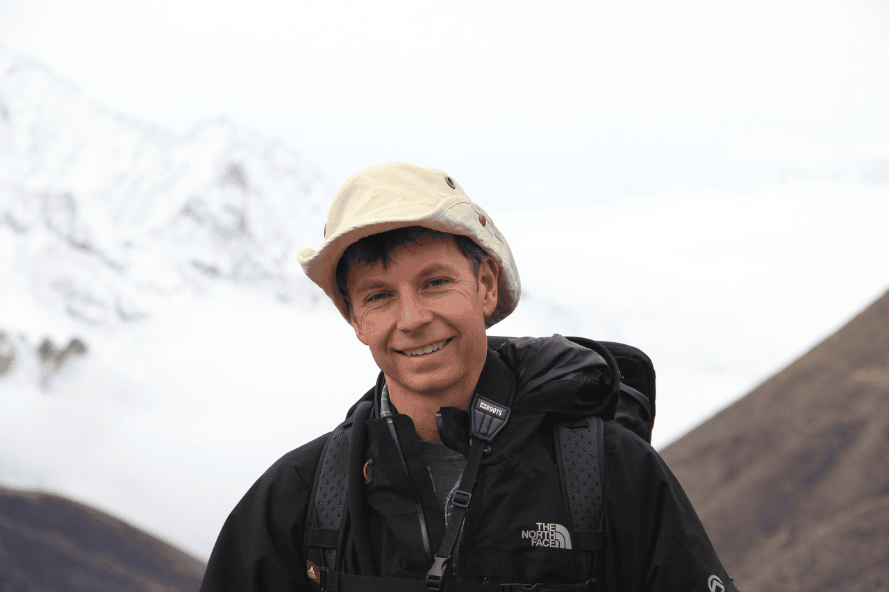 Kevin Thomason smiles for the camera as he hikes.