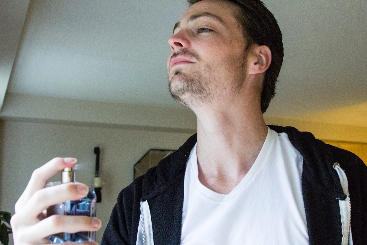 fragrance sprayed on man
