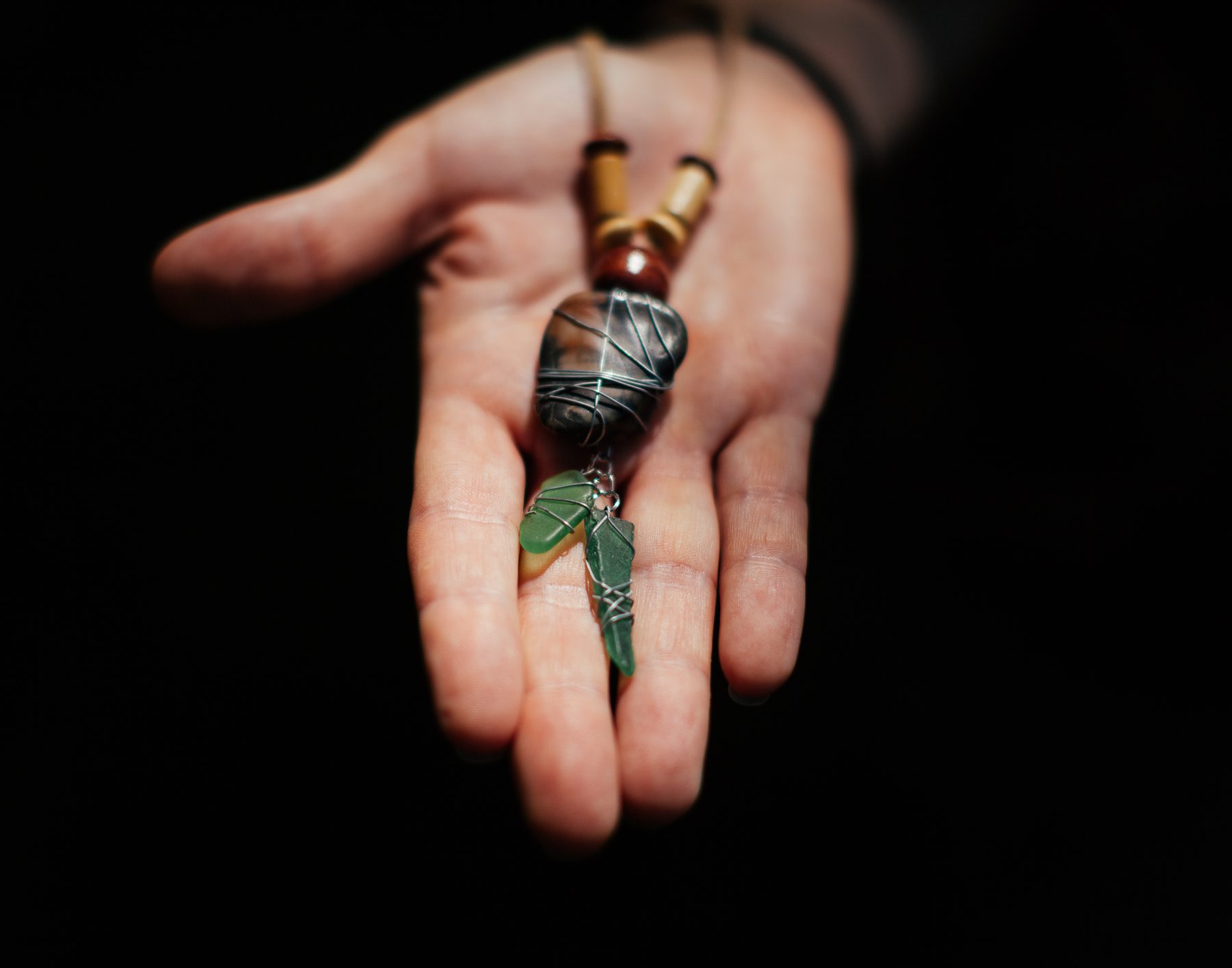 Heidi has spent a lot of time walking up and down the beach collecting beach glass. Some of it she has turned into jewelry, like this piece.
