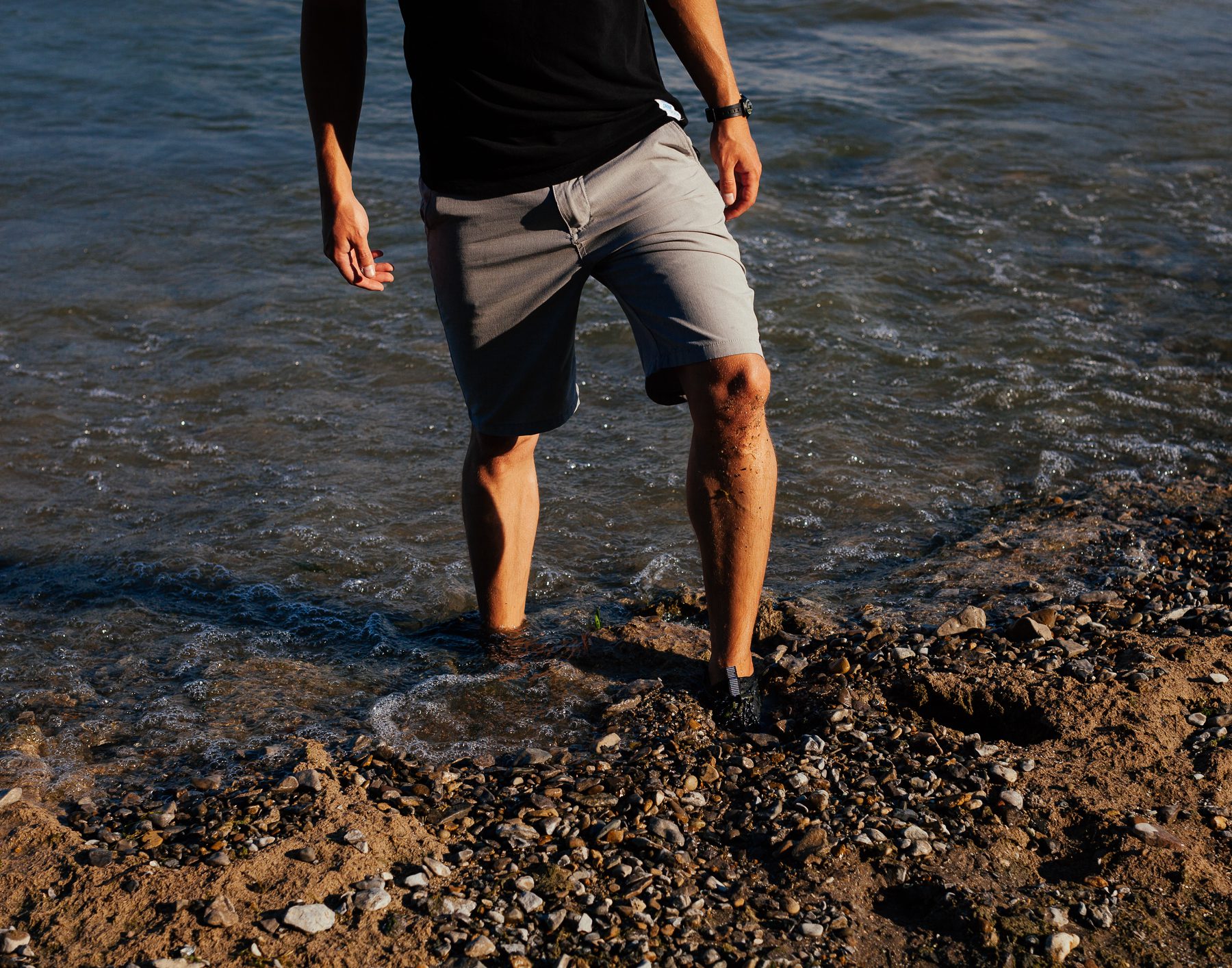 Gregary’s feet sink deep into the Cladophora that is rotting on the shoreline. 