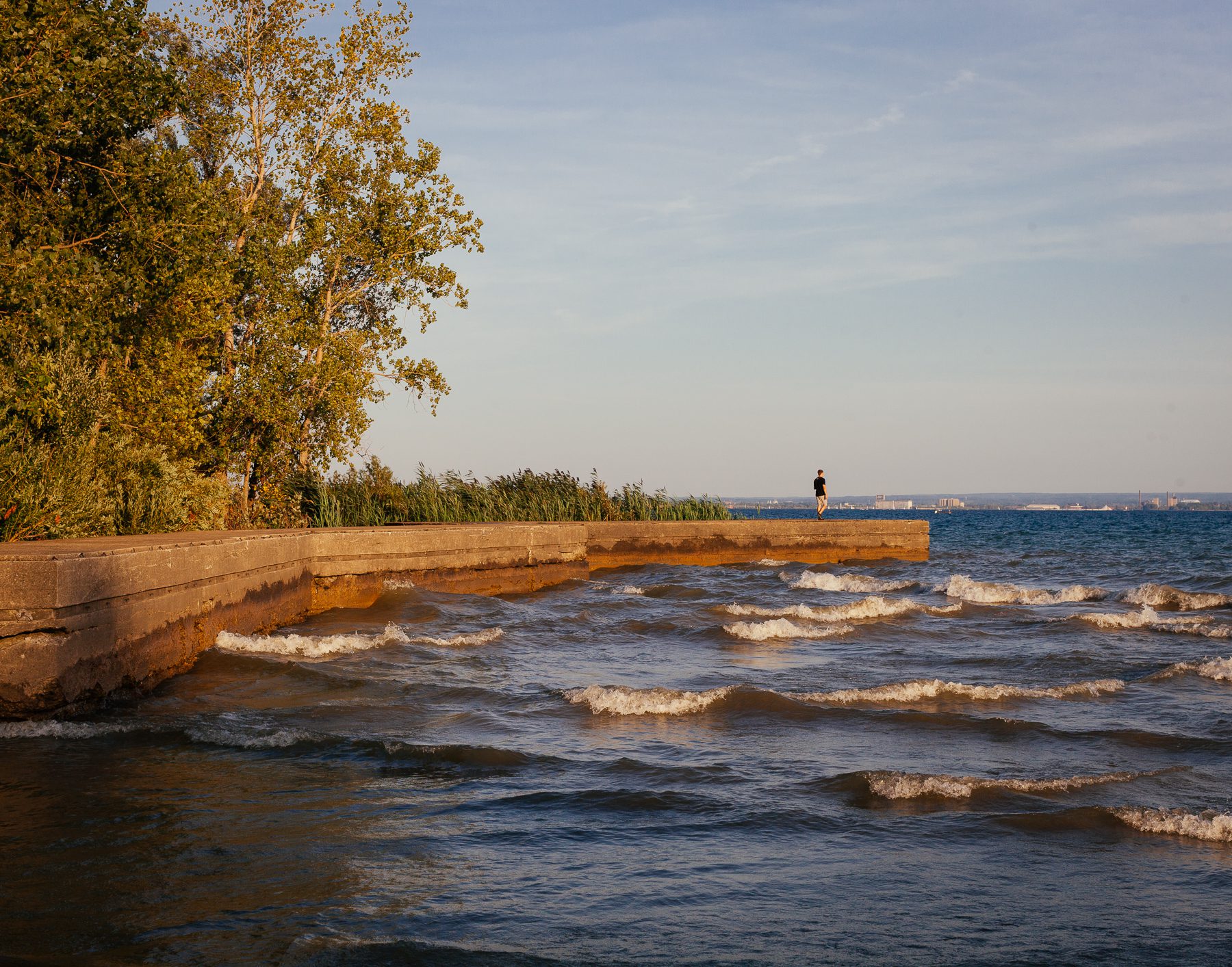 While living and working by the lake, Gregary has enjoyed learning more about the local history. One test site he visits regularly is Waverly Beach, which looks out at Buffalo, USA. Here, Gregary walks out on the tip of what used to be the world’s largest outdoor swimming pool as part of Erie Beach Amusement Park that opened in 1890.