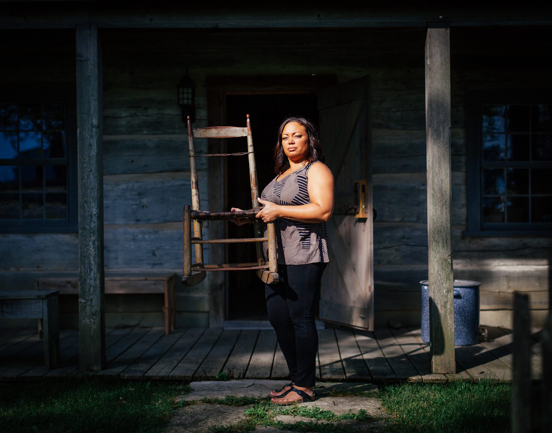 Michelle holds her family’s oldest heirloom. This chair now sits in the Colbert-Henderson House (a house from the early settlement built in 1852, that now sits on the museum grounds). 