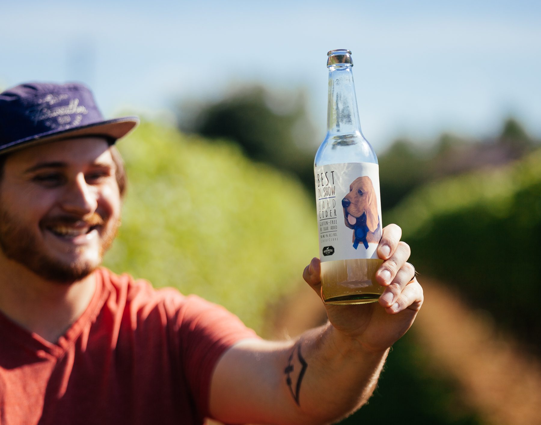 Dan from Hamilton, holds up a cider he is trying on his tour of the winery. All of their wines/ciders have a hound-inspired name, like the “sassy bitch” and the “hound and the hare”
