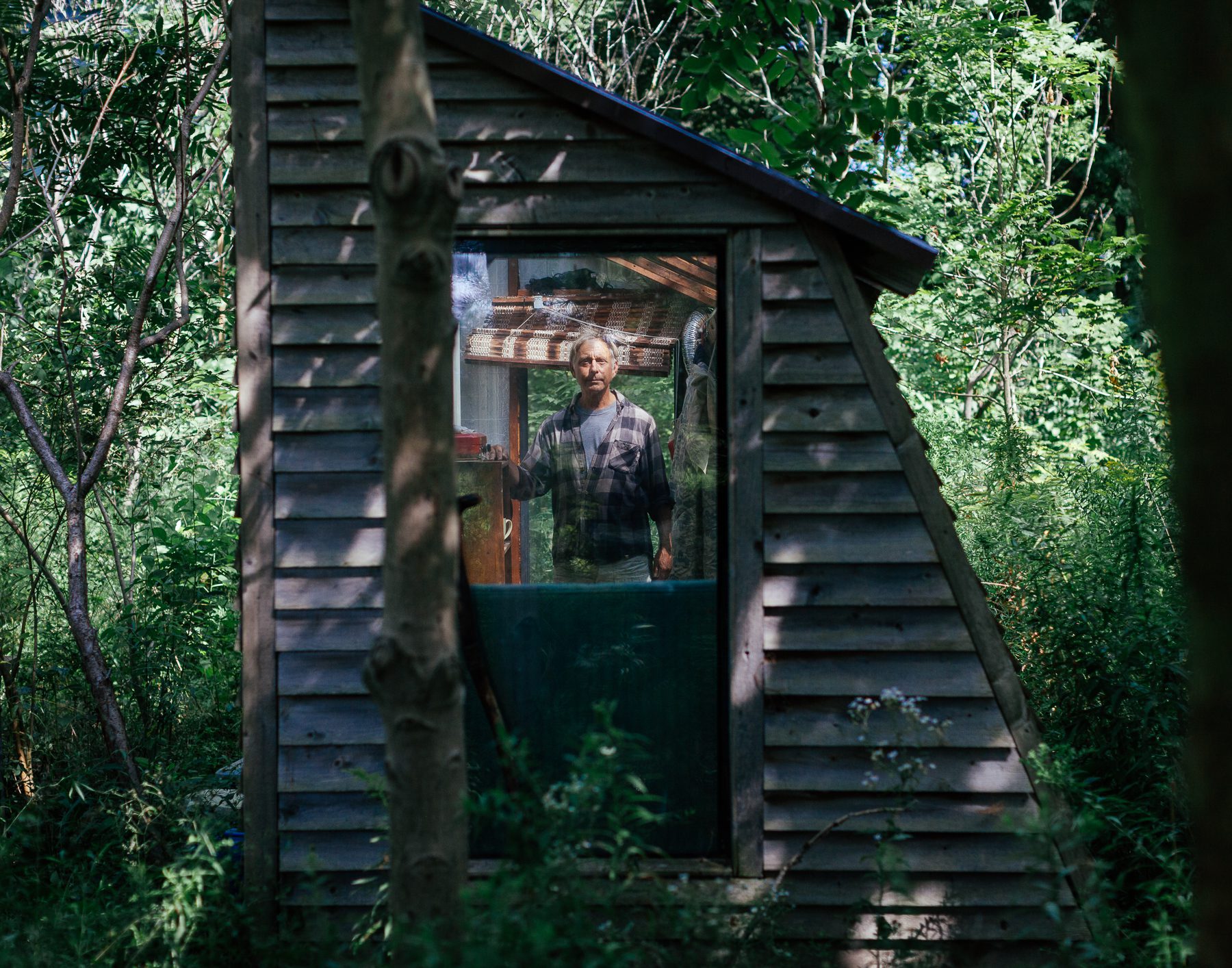 Aside from his fleet of vehicles, Ken’s property is full of many other exciting creations like a small greenhouse he built in the back in the forest. It is where Ken sleeps most nights when the weather is nice, and the rest of the year it is where he dries his clothes.