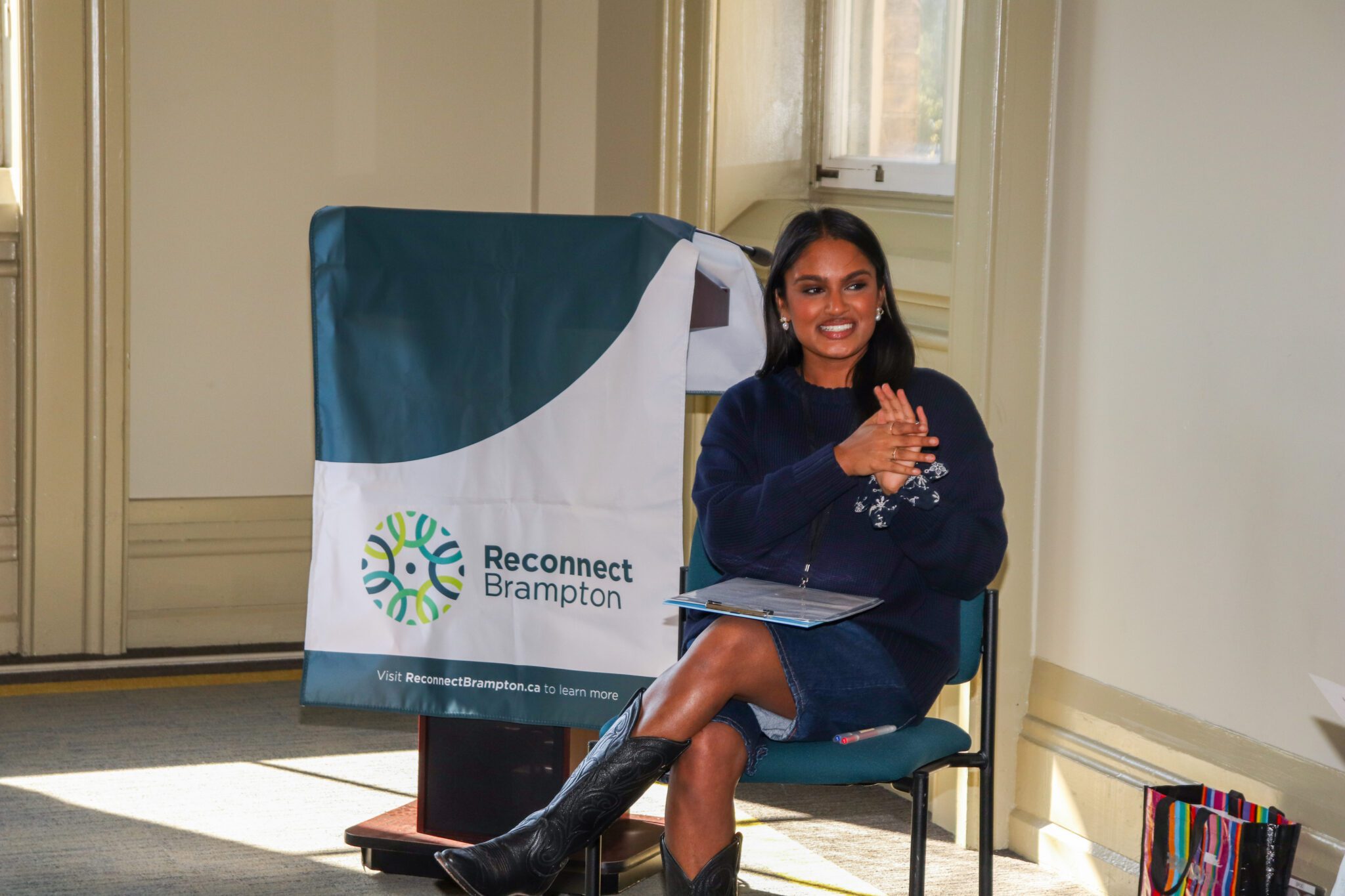 Halley Patel speaking for Reconnect Brampton at Clothing Swap