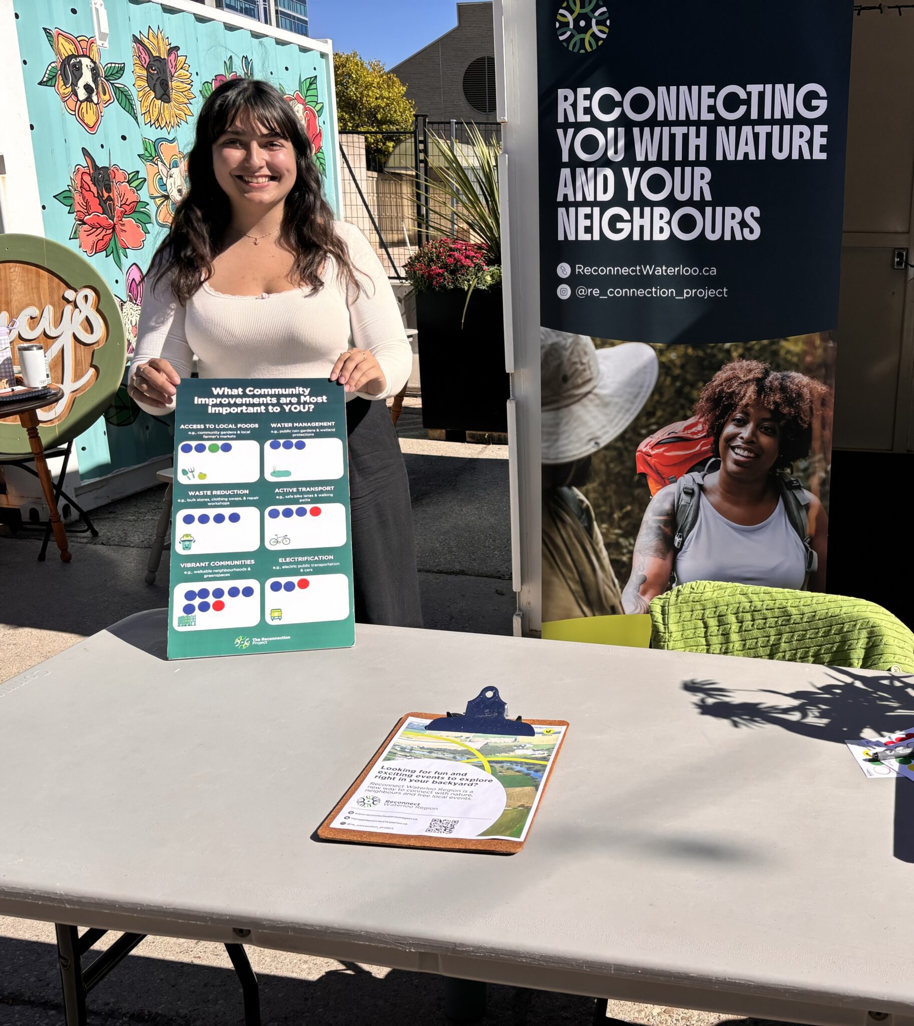 Maria tabling for Reconnect Waterloo Region Summer 2025 Photo